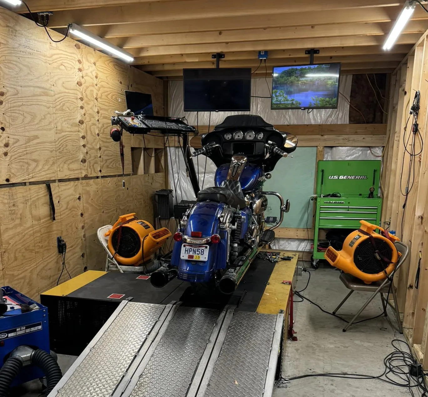 Blue Harley-Davidson Street Glide on the dyno in the FKN Performance dyno room