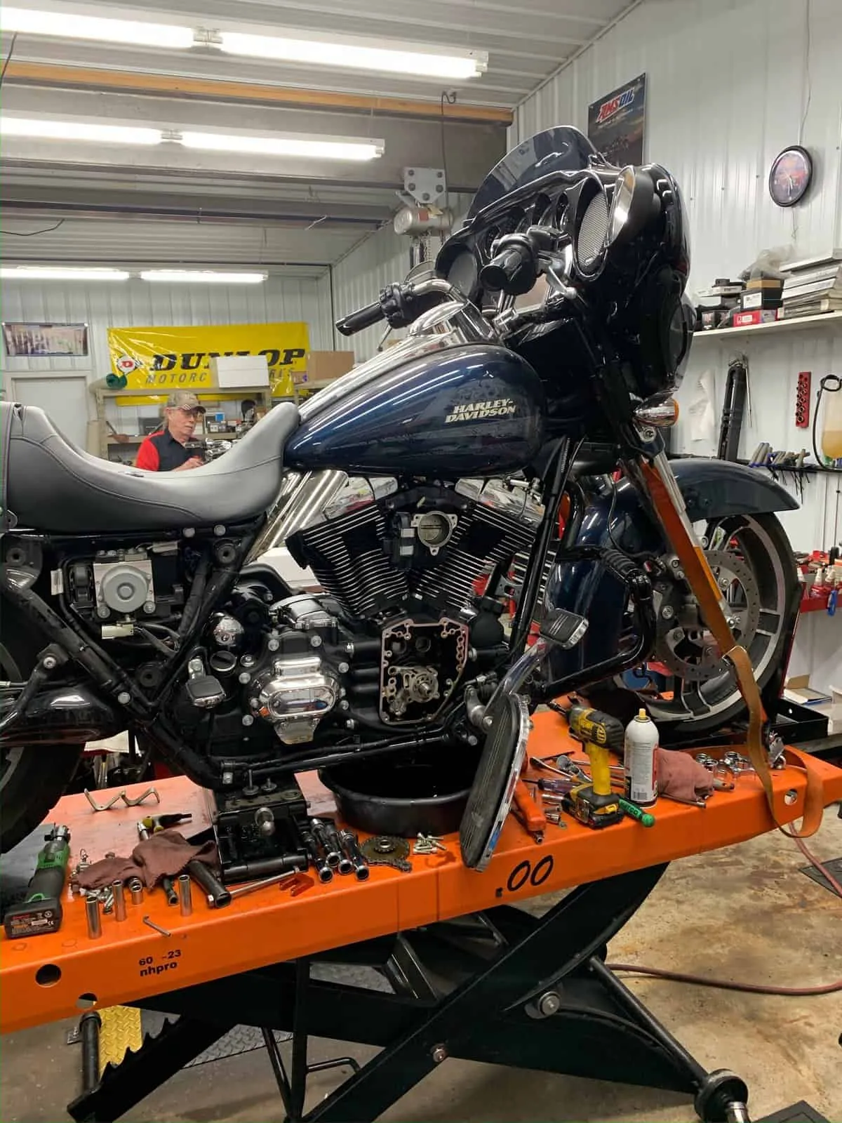 Harley bagger on a lift in the FKN Performance shop during a repair
